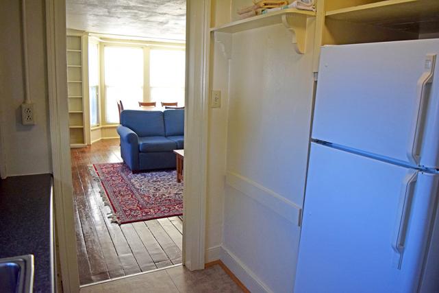 Galley kitchen includes full-size refrigerator
