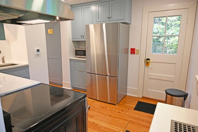 Kitchen includes refrigerator and microwave, and second door access