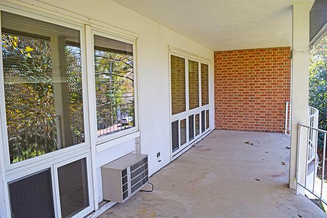 Two-bedroom apartments feature picture windows looking onto the private patio