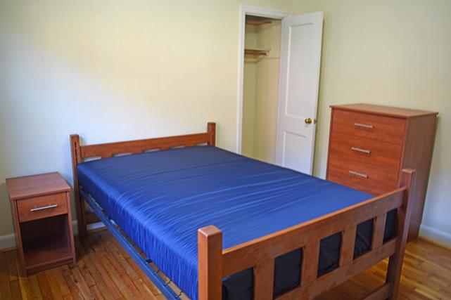 Furnished apartments include a 5-drawer dresser and nightstand in bedrooms with closets