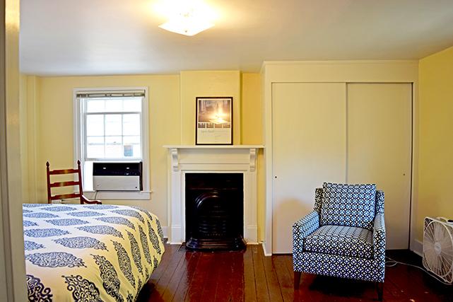 Bedroom includes a mantel and closet space